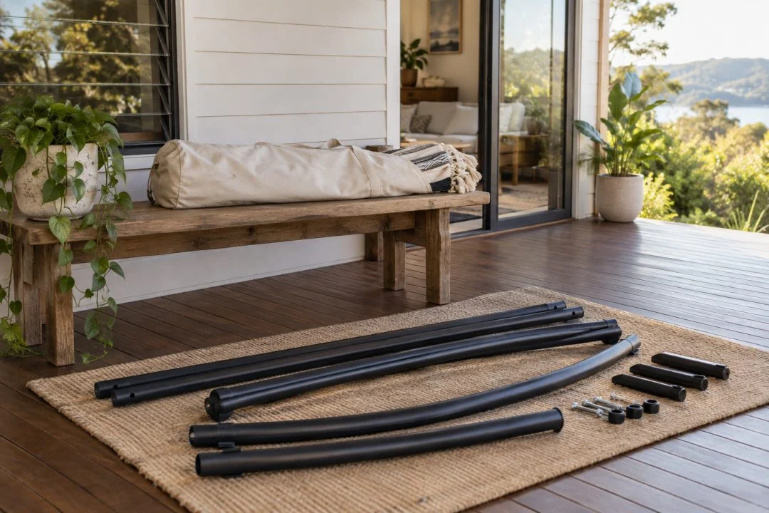 An uninstalled hammock and stand components set out before assembly.